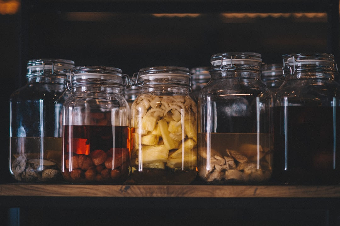 clear glass jars with brown and white stones on Earth Wise Budget