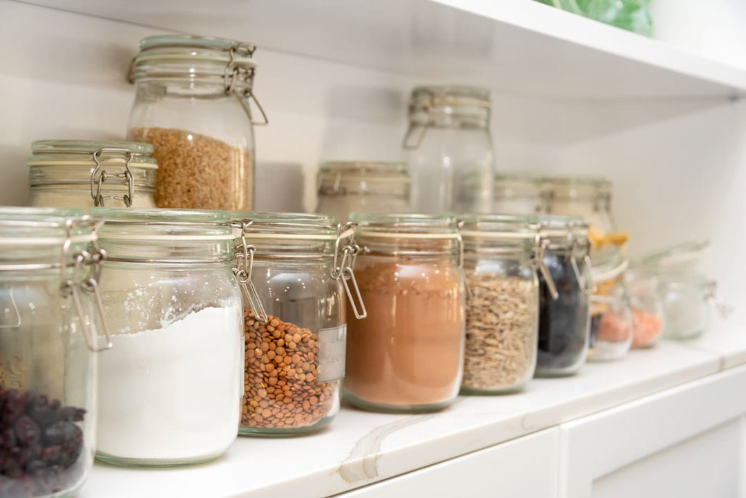 a row of jars filled with different types of food on Earth Wise Budget