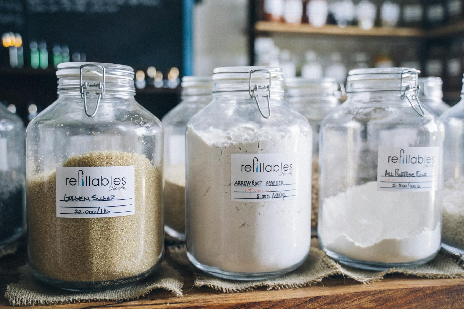 A variety of bulk organic ingredients in refillable glass jars at an eco-friendly store. on Earth Wise Budget