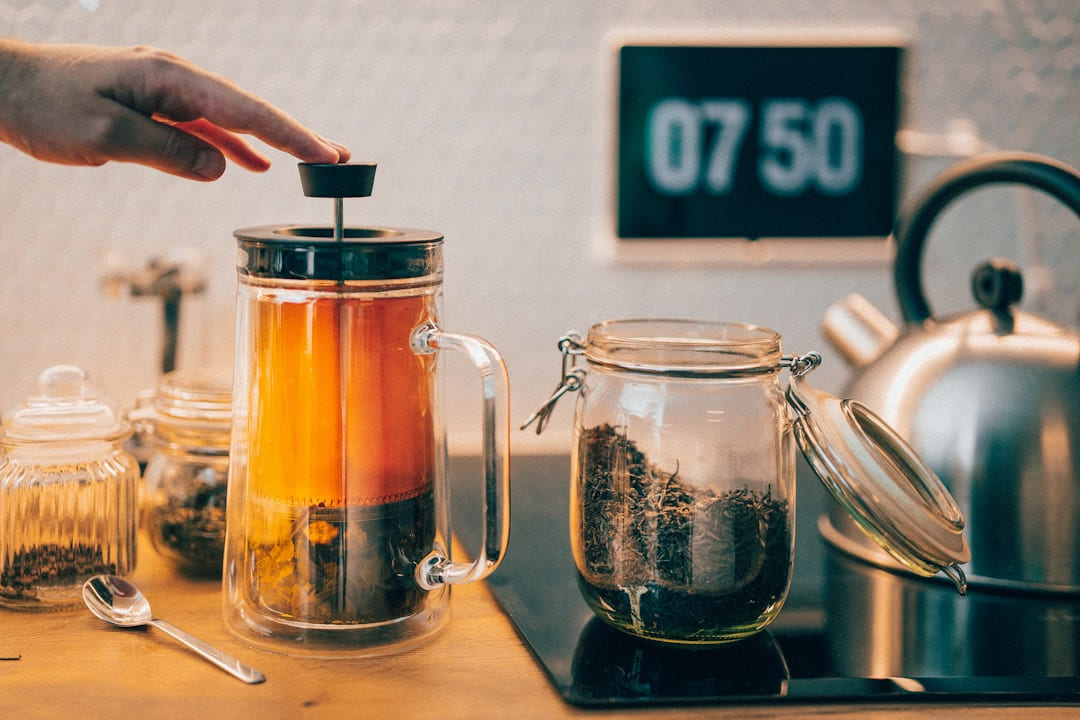 A person is putting something in a jar on Earth Wise Budget
