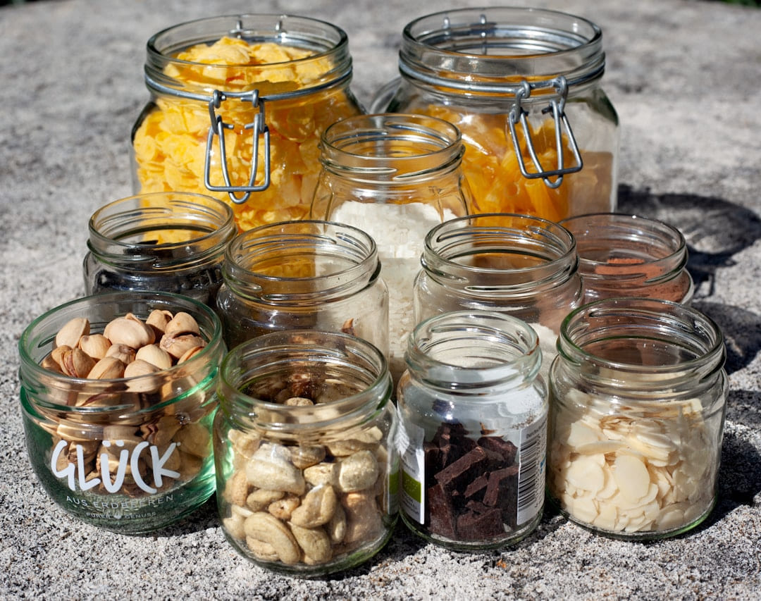 clear glass jars with white and brown stones on Earth Wise Budget