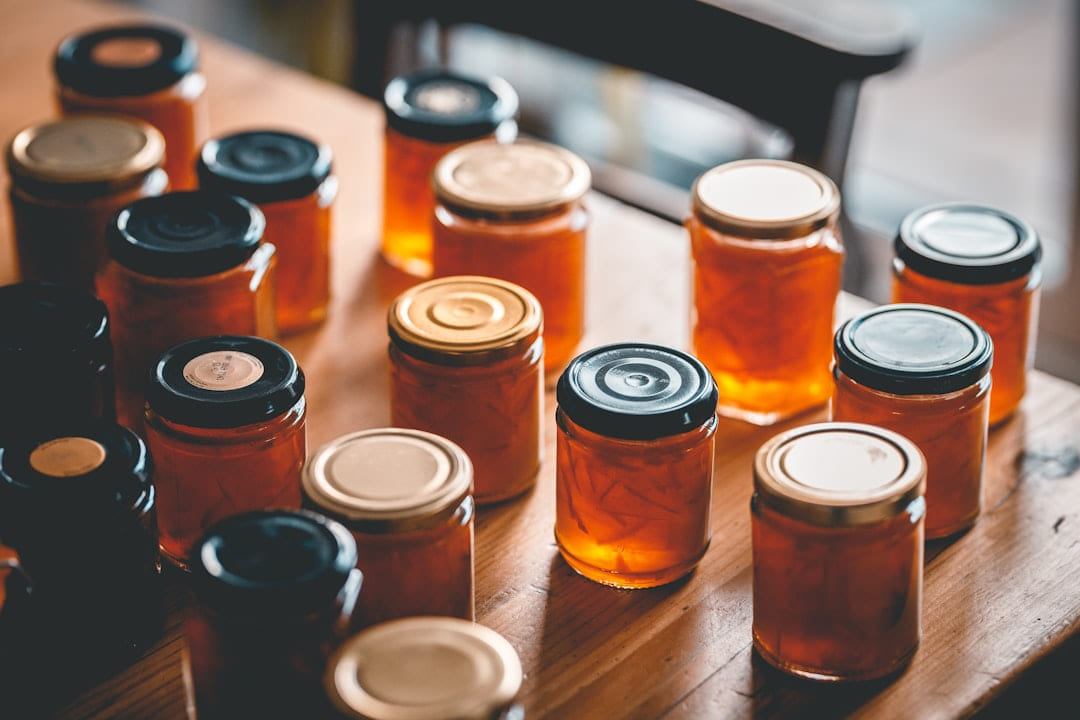 a table topped with lots of jars filled with liquid on Earth Wise Budget