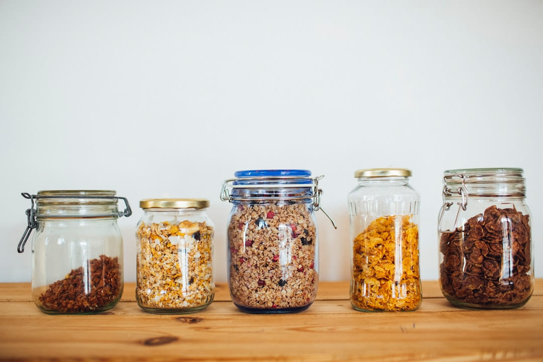 two clear glass jars with brown and black beads on Earth Wise Budget