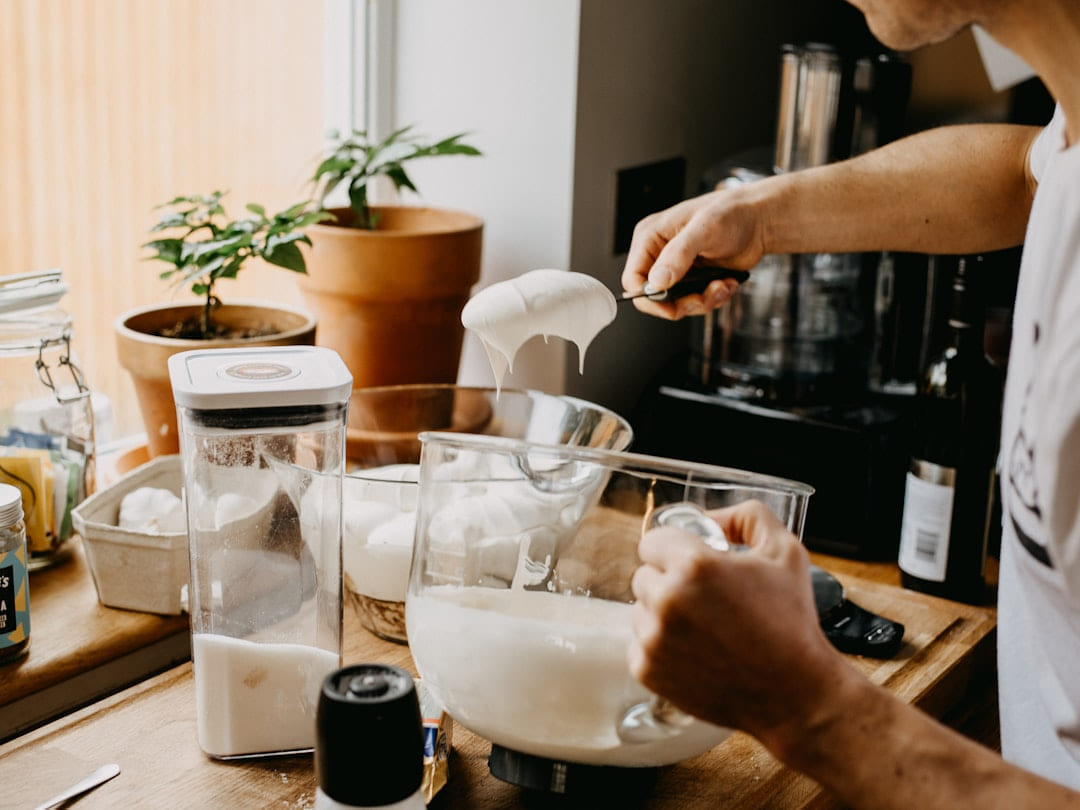 person holding clear drinking glass on Earth Wise Budget