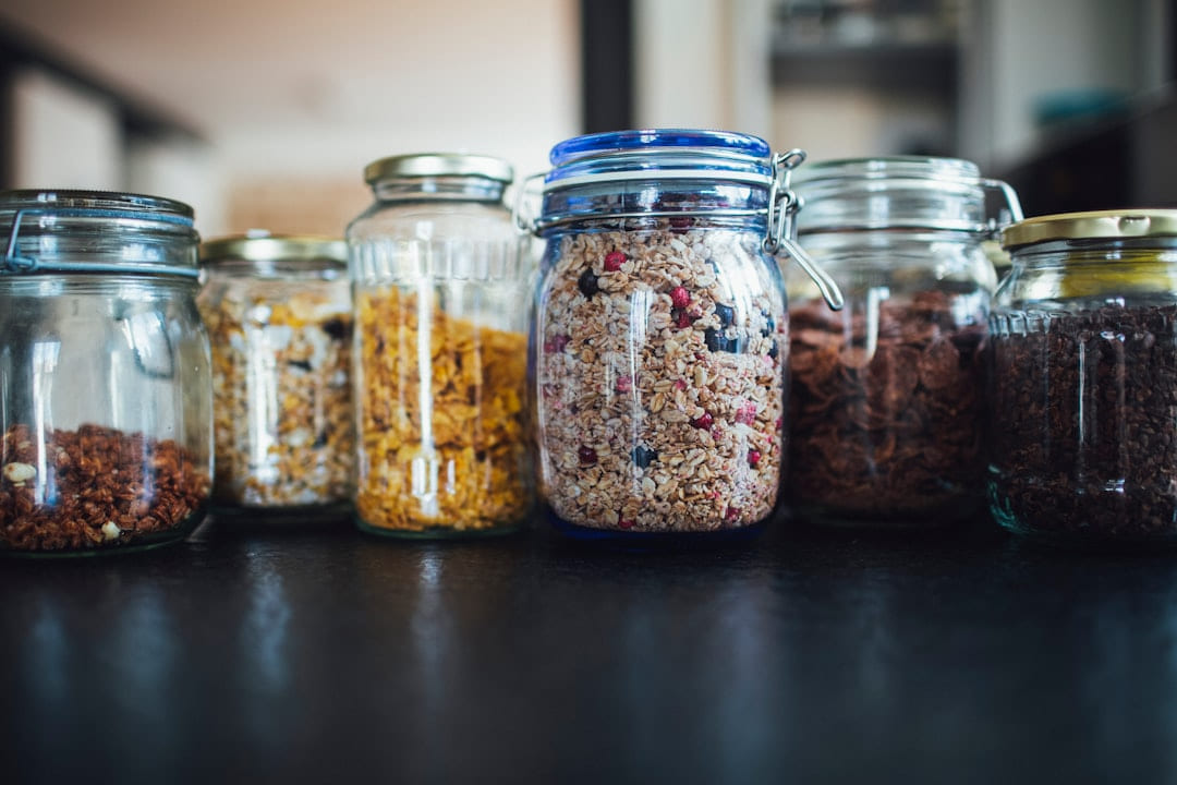 brown and white beans in clear glass jar on Earth Wise Budget