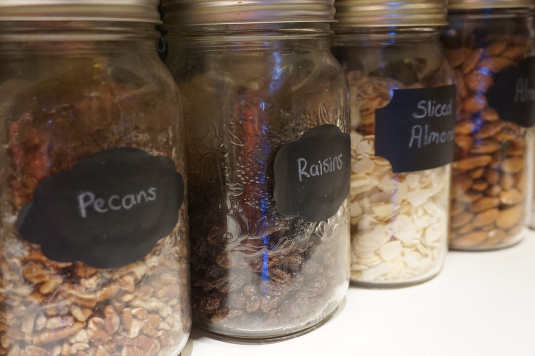 a row of jars filled with different types of food on Earth Wise Budget