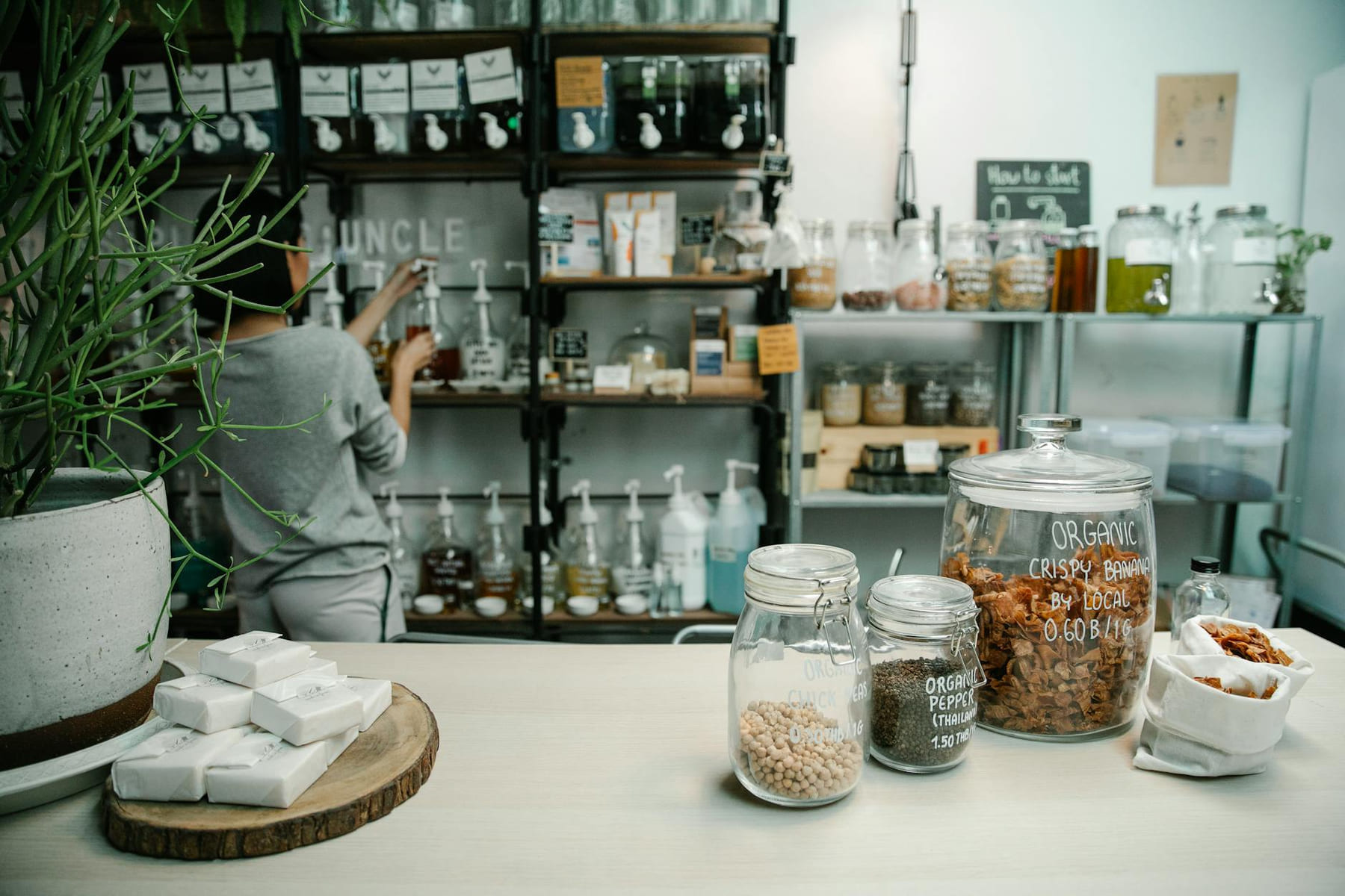 Inside an organic food store with jars and eco-friendly items on display. on Earth Wise Budget